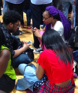 Hillary-Kids-Waiting-With-Phones-SM