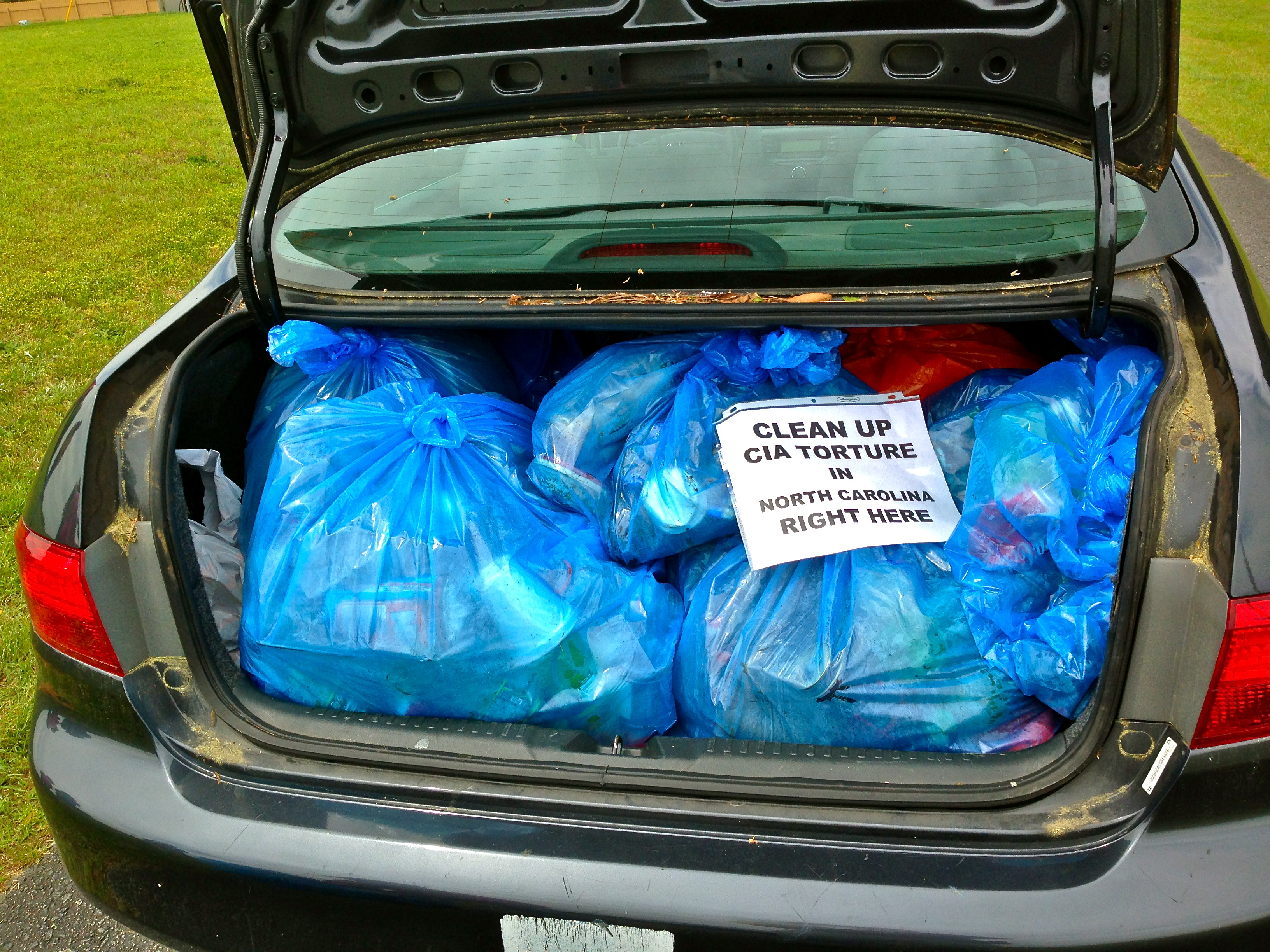 A Trunk Full of Torture Trash outside Aero Contractors in Smithfield NC